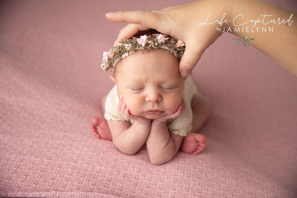 Studio assistant demonstrating newborn photography safety
