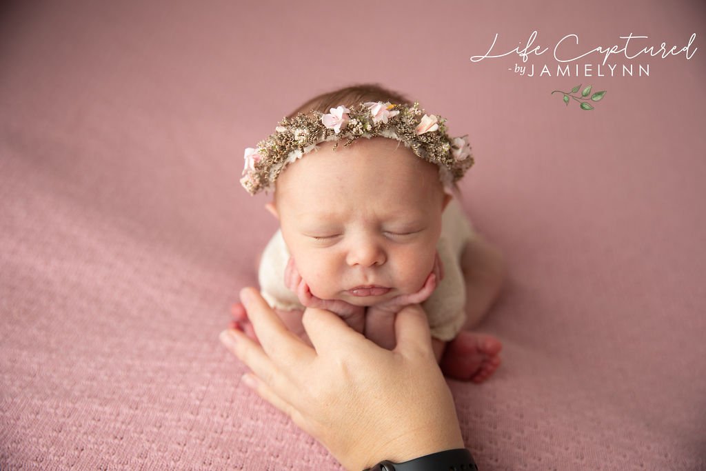Studio assistant demonstrating newborn photography safety