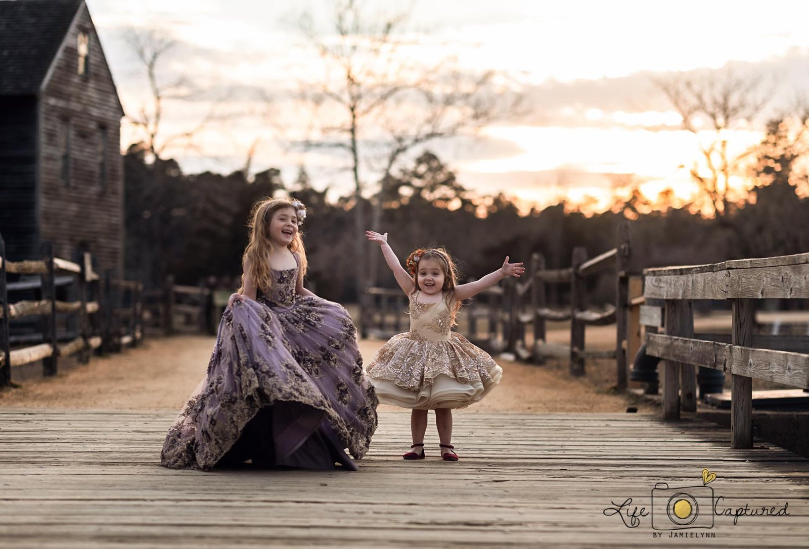 young girls in flowing gowns during a family photo session