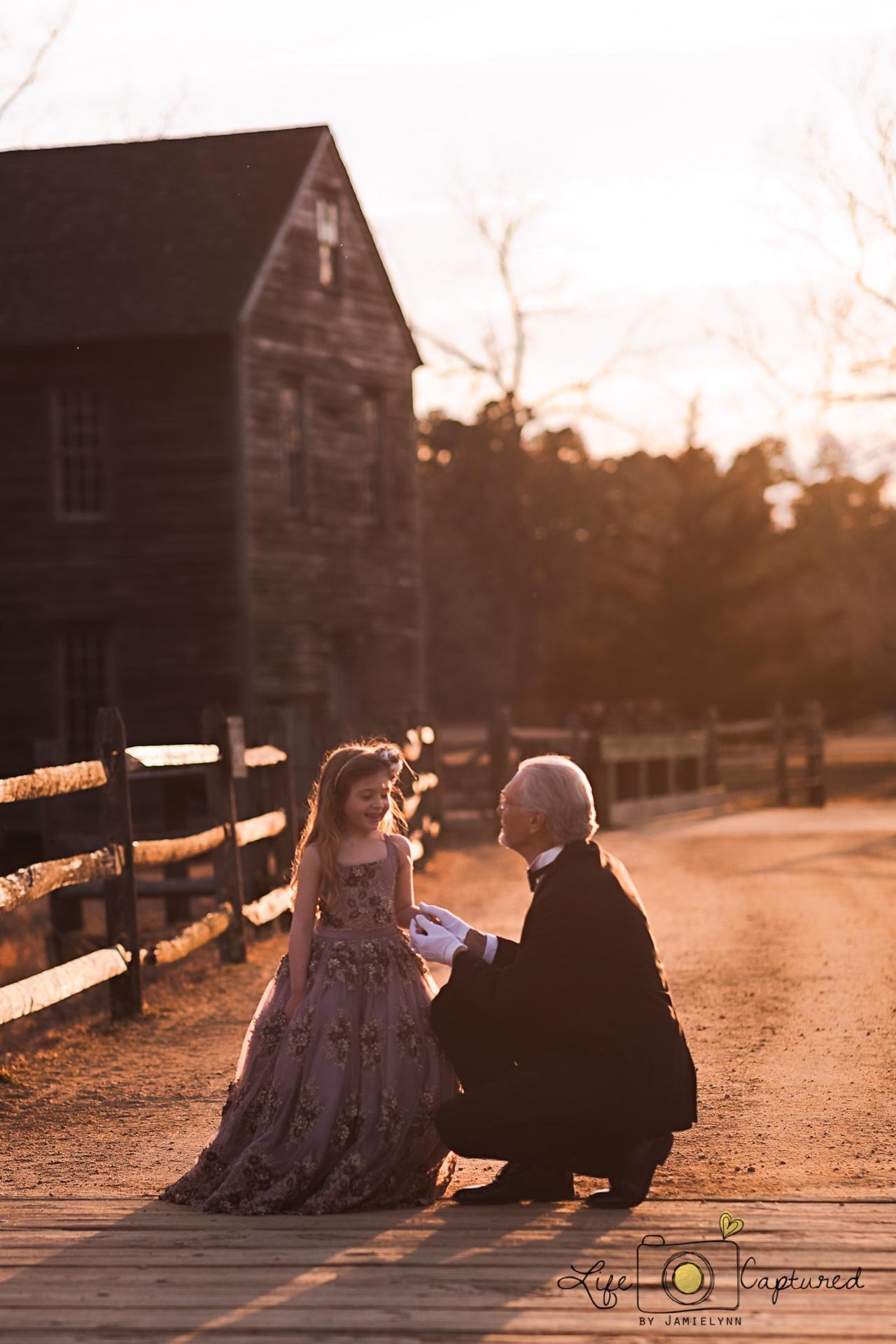 Family portrait of granddaughter with her grandfather formally dressed